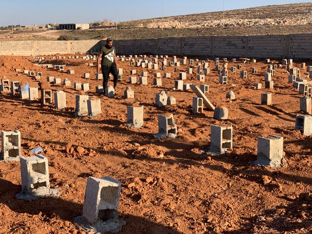 <p>Graves of flash flood victims in Derna on Friday, marked with pieces of rubble</p>