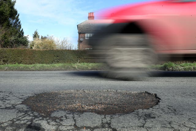 Common problems caused by potholes include damaged shock absorbers, broken suspension springs and distorted wheels (Gareth Fuller/PA)
