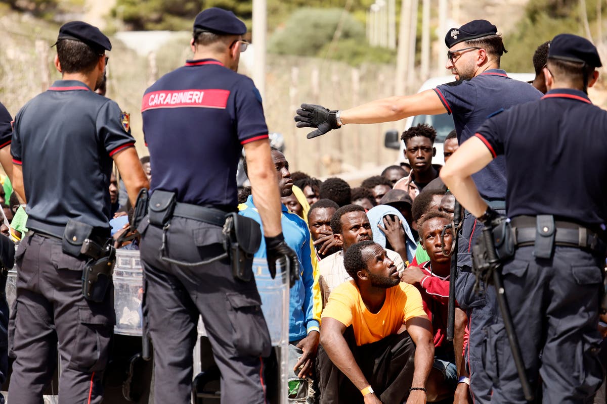 Top EU official heads to an Italian island struggling with migrant influx as Italy toughens stance