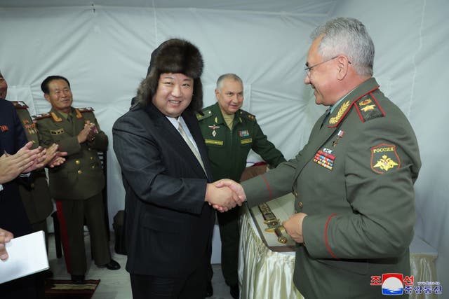 <p>North Korean leader Kim Jong-un shakes hands with Russian defence minister Sergei Shoigu during a visit to Vladivostok on Saturday </p>