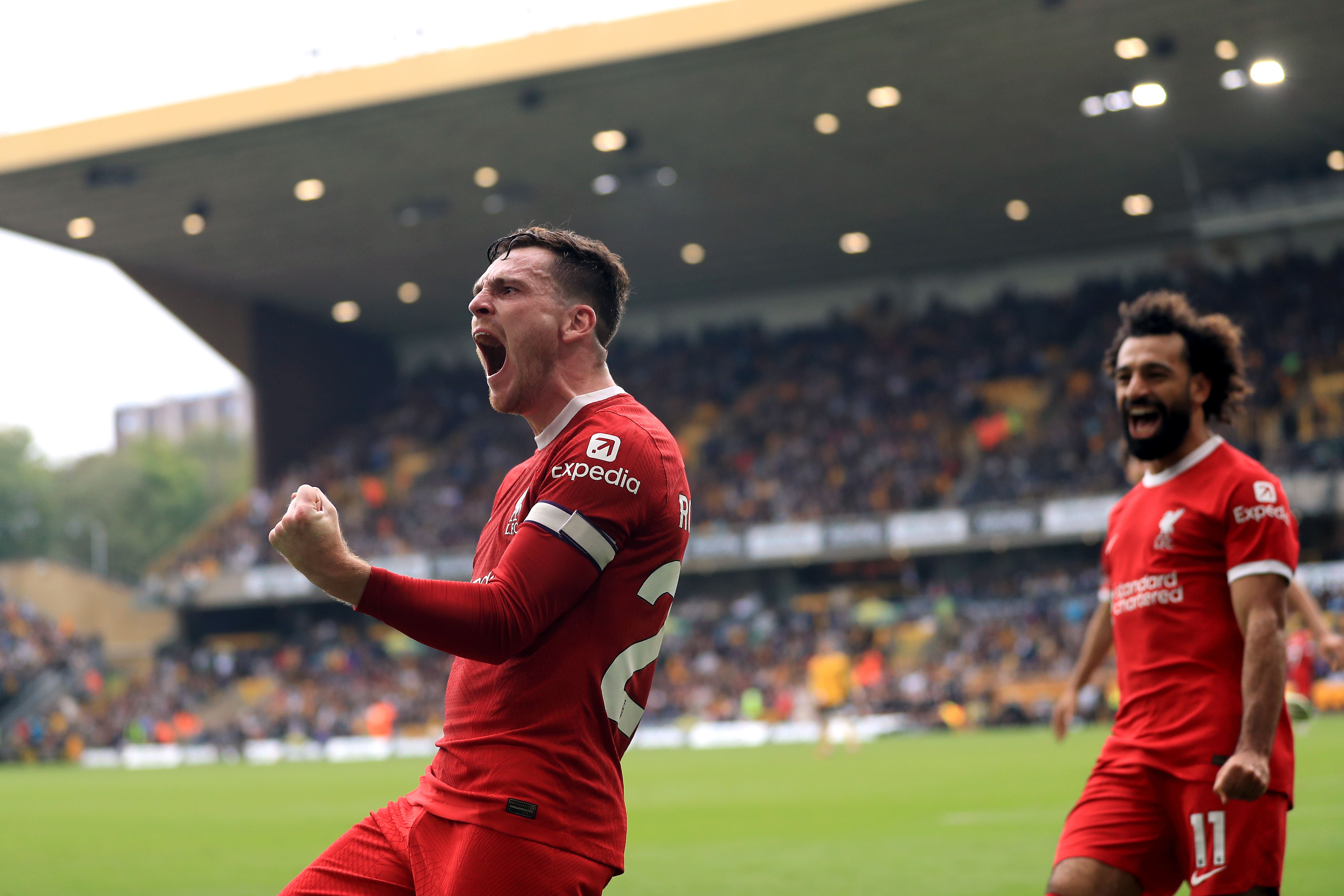 Liverpool’s Andrew Robertson, left, celebrates his goal with Mohamed Salah (Bradley Collyer/PA)