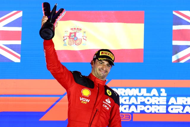 <p>Spain’s Carlos Sainz of Ferrari celebrates on the podium at Marina Bay Street Circuit  </p>