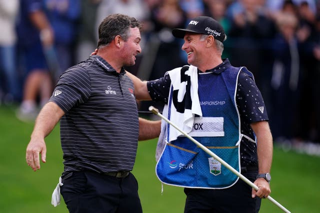 Ryan Fox celebrates with caddie Dean Smith after winning the 2023 BMW PGA Championship at Wentworth (John Walton/PA)