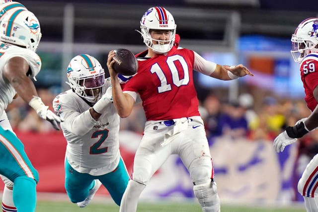 Miami Dolphins linebacker Bradley Chubb brings down New England Patriots quarterback Mac Jones during the fourth quarter (Steven Senne/AP)