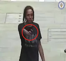 Terrifying moment teenager aims loaded handgun at cyclist in city centre