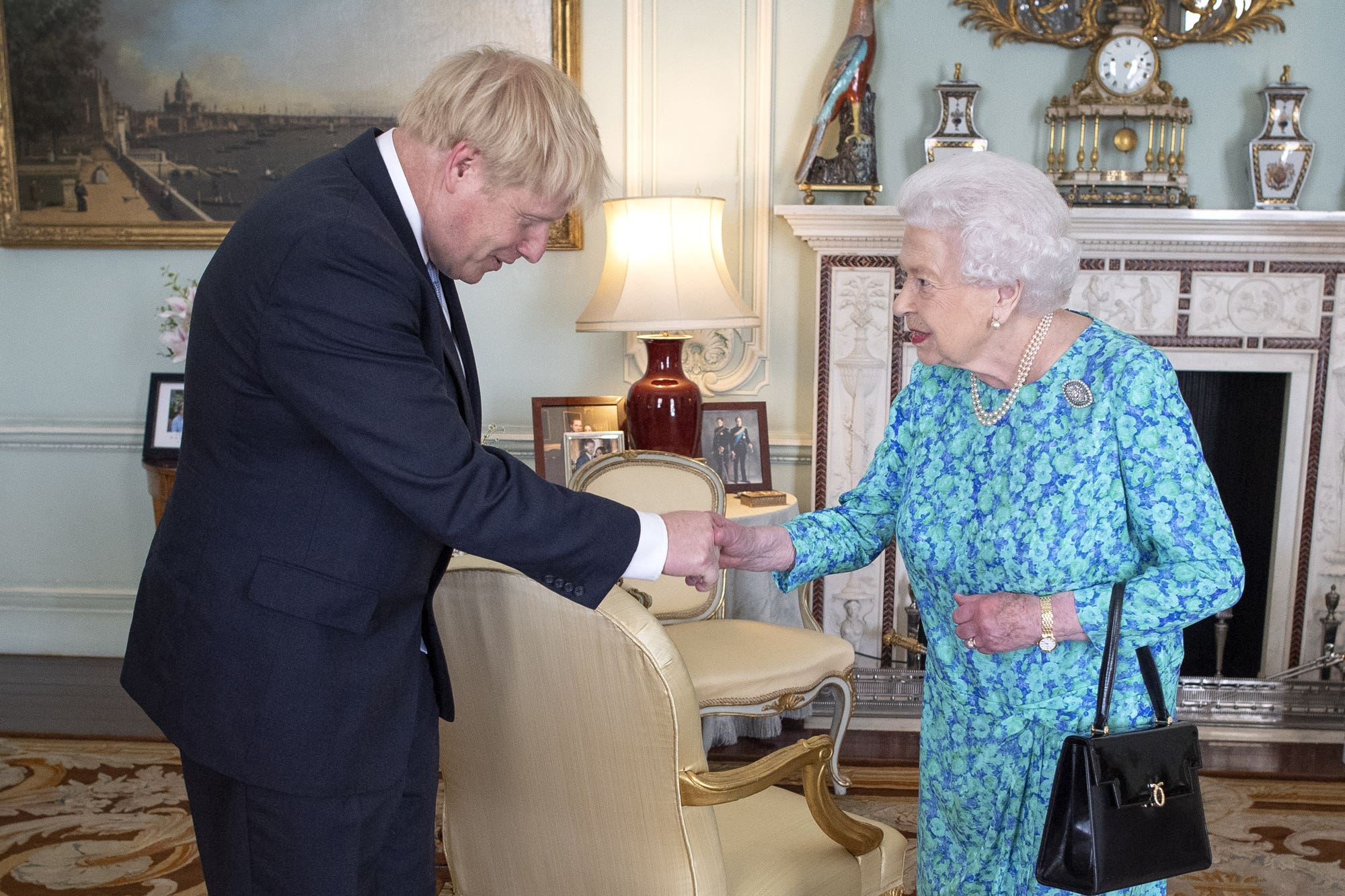 Queen Elizabeth II welcoming the newly-elected leader of the Conservative party Boris Johnson during an audience in Buckingham Palace