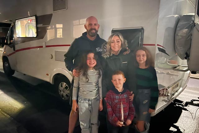 <p>The family with their campervan, November 2022. </p>