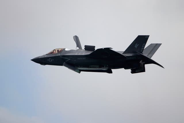 <p>FILE - A United States Marine Corps F-35B Lightning II takes part in an aerial display during the Singapore Airshow 2022 at Changi Exhibition Centre in Singapore, Feb. 15, 2022. </p>