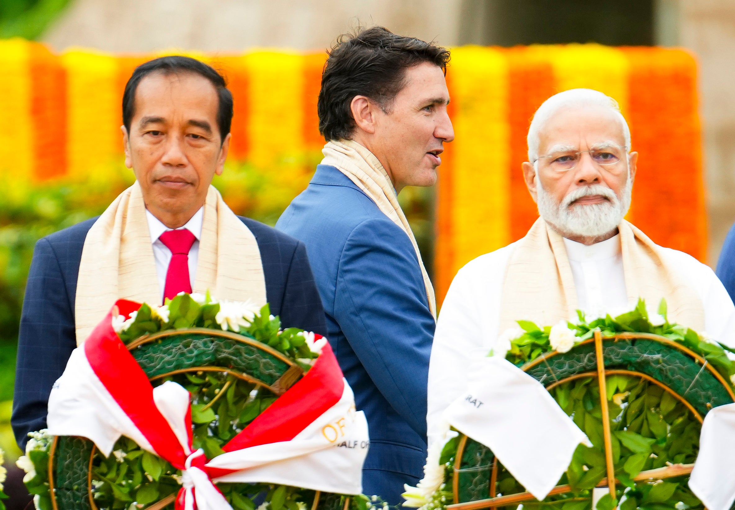 Trudeau walks past Narendra Modi and Indonesia’s president Joko Widodo as they take part in a wreath-laying ceremony at Raj Ghat (Mahatma Gandhi's cremation site) during the G20 Summit