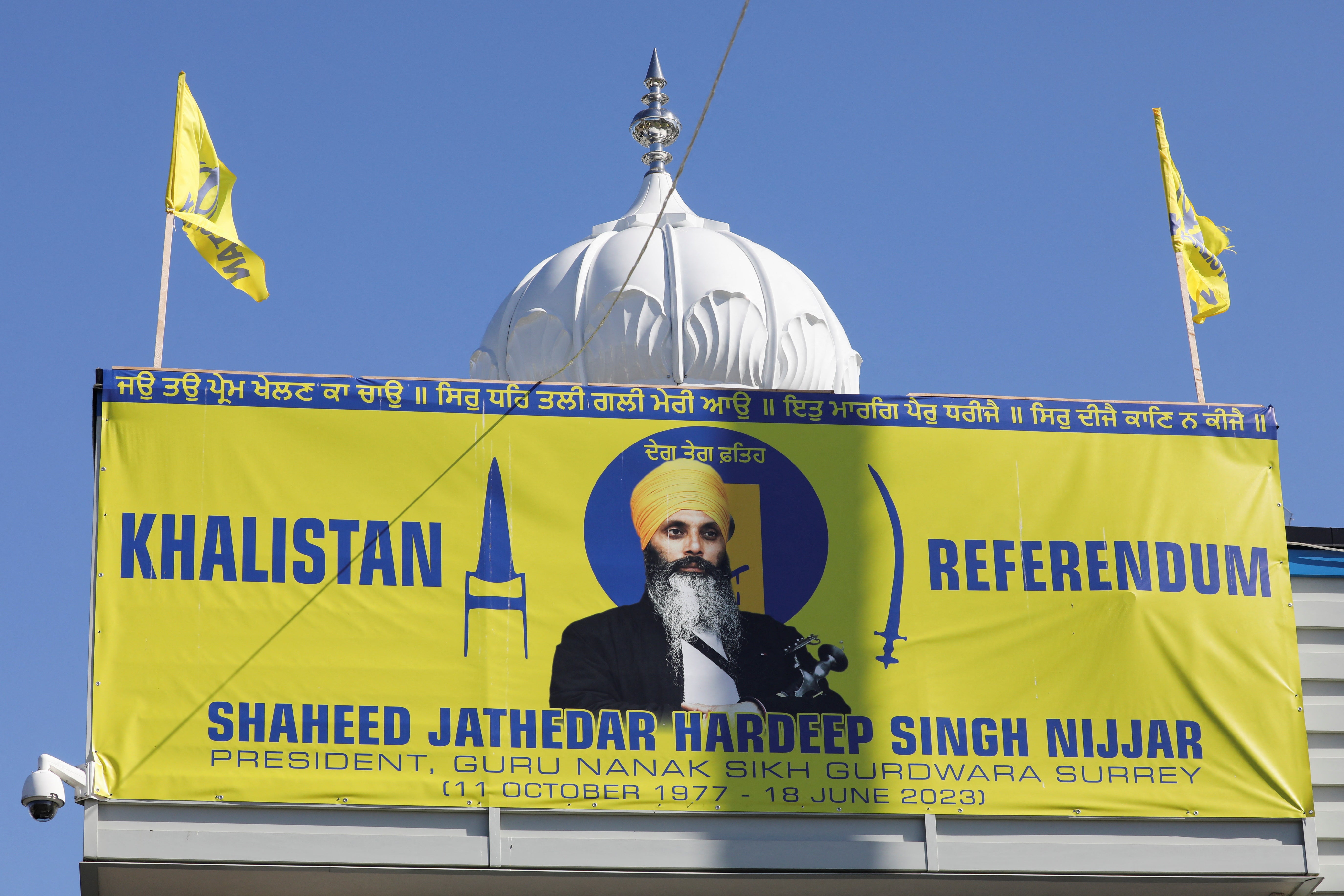 A banner with the image of Sikh leader Hardeep Singh Nijjar at the Guru Nanak Sikh Gurdwara temple, site of his June 2023 killing, in Surrey, Canada