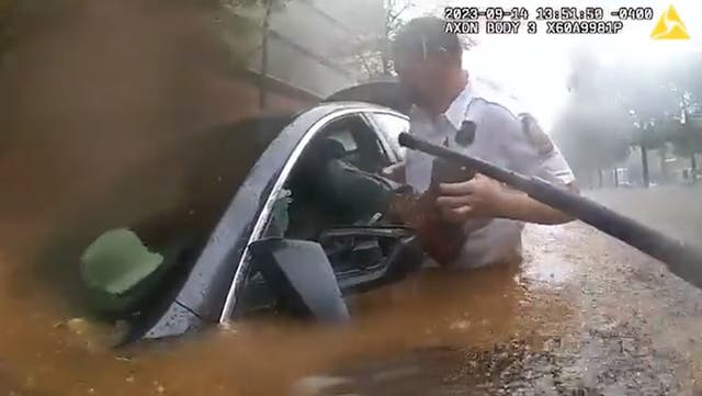 <p>Trapped driver in flooded car rescued in dramatic police bodycam footage. </p>