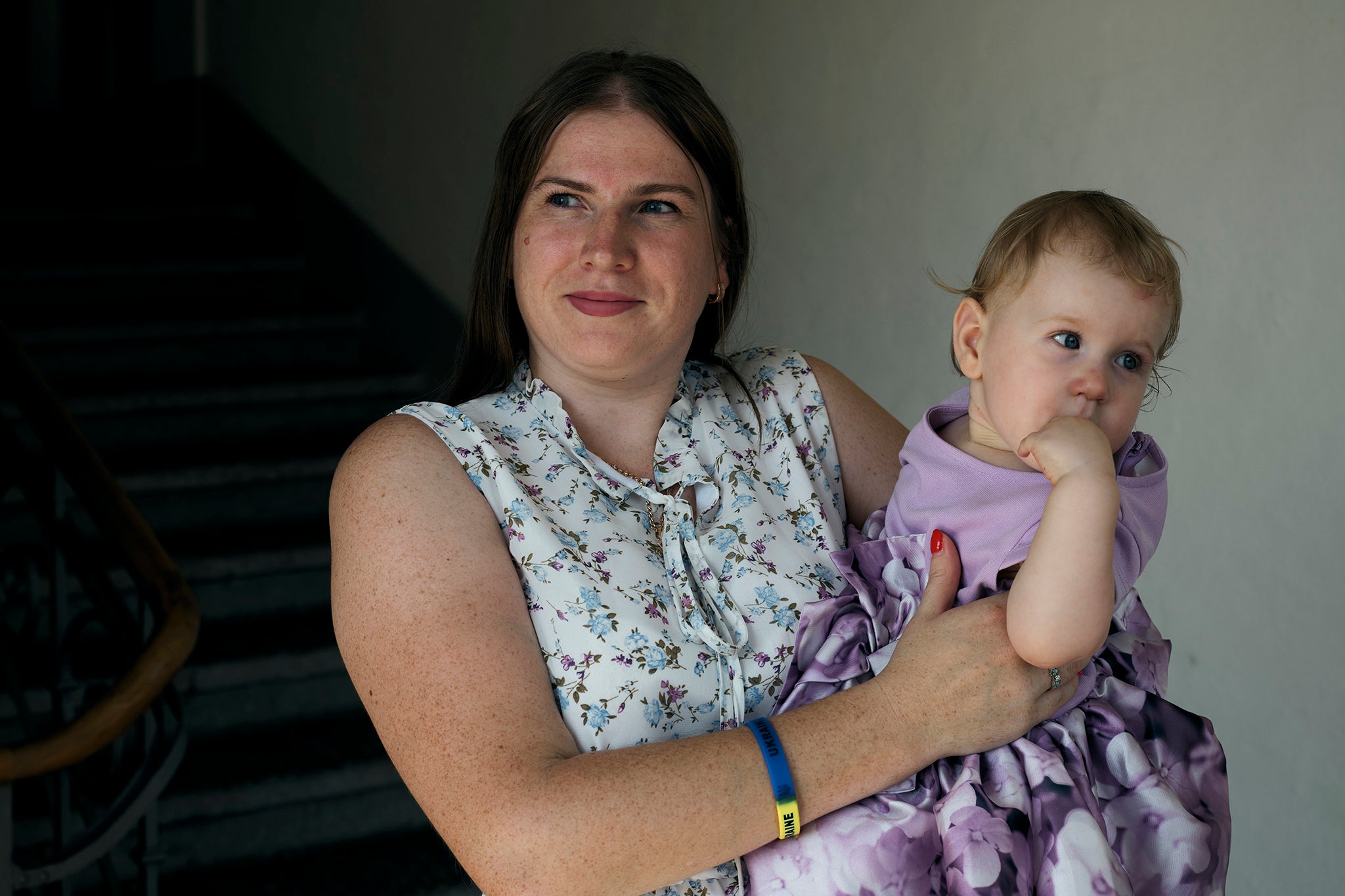 Tatiana, 35, from Odesa, holds her Swiss-born daughter Viktoria, who recently celebrated her first birthday