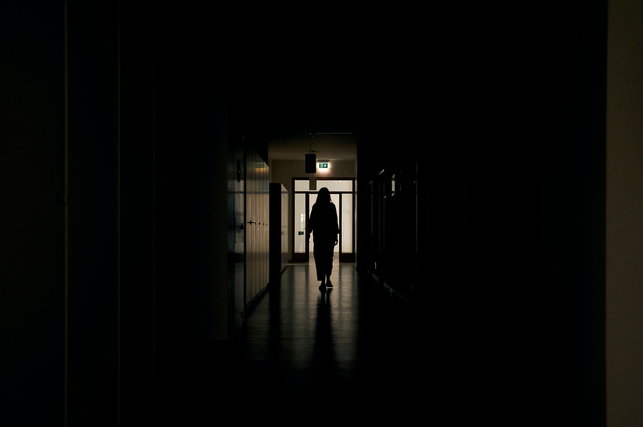 Hana, 28, from Odesa, walks the long gloomy corridor in the southern wing of the convent