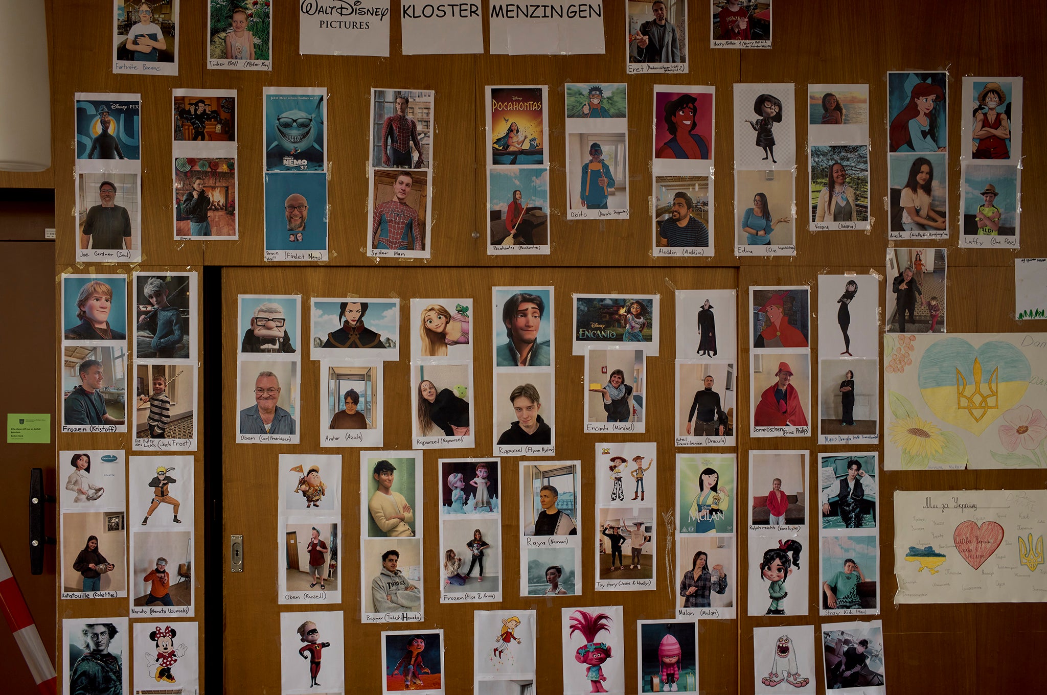 A wall in the canteen at Kloster Menzingen where residents and staff post their photographs and Walt Disney look-alike cartoon characters