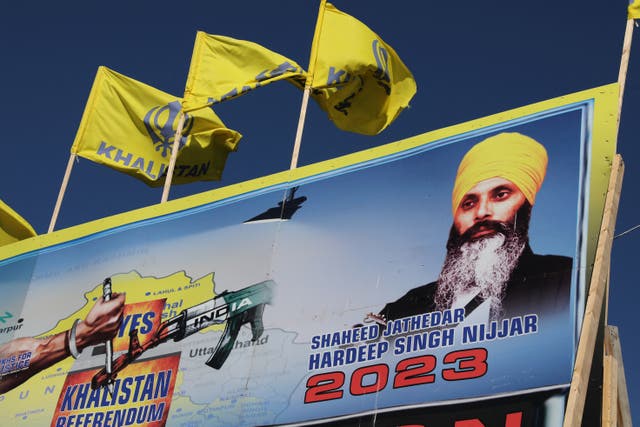 <p>A mural features the image of late Sikh leader Hardeep Singh Nijjar, who was slain on the grounds of the Guru Nanak Sikh Gurdwara temple in June 2023 in Surrey</p>