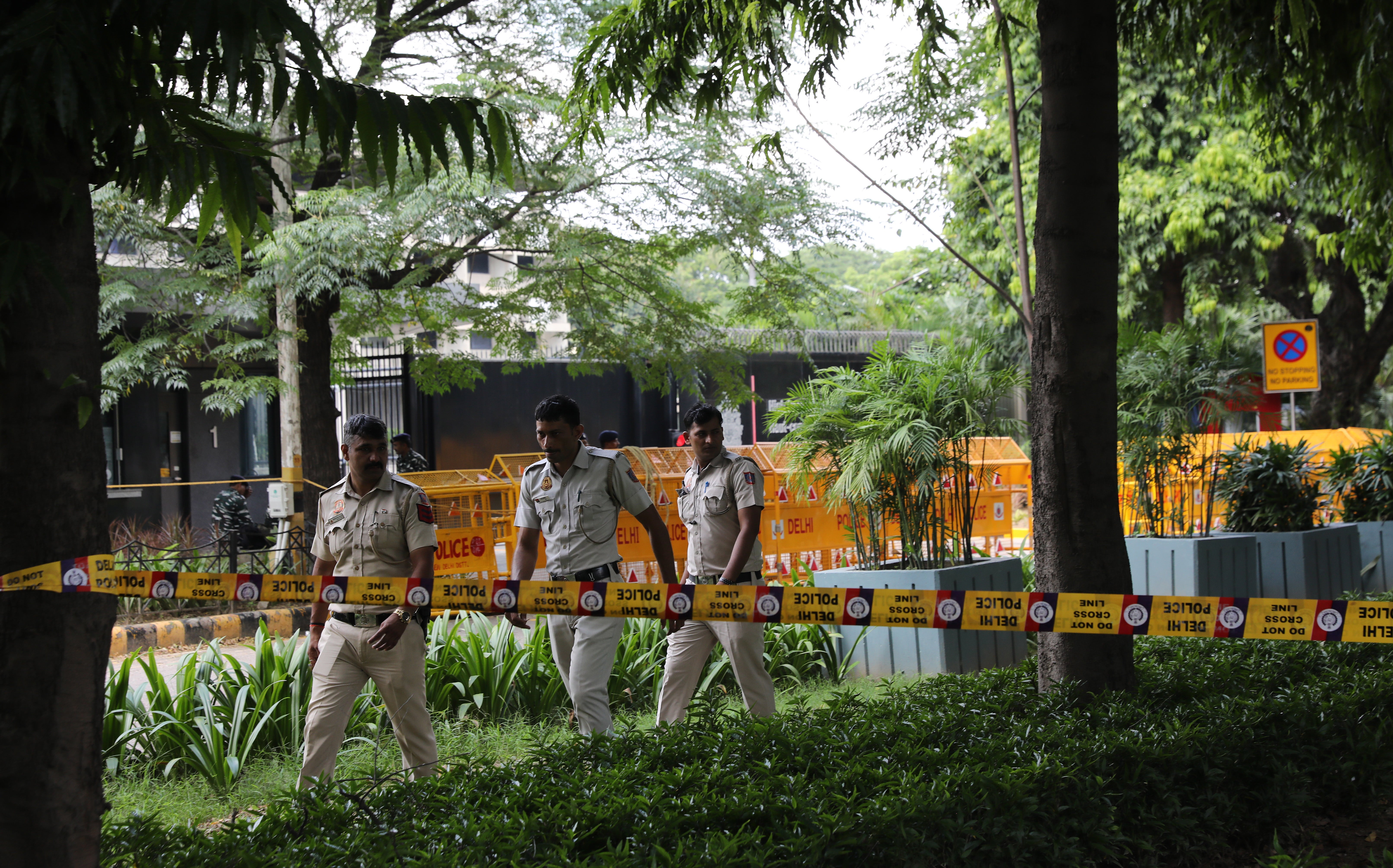 Indian policemen secure the premises around the Canadian embassy in New Delhi