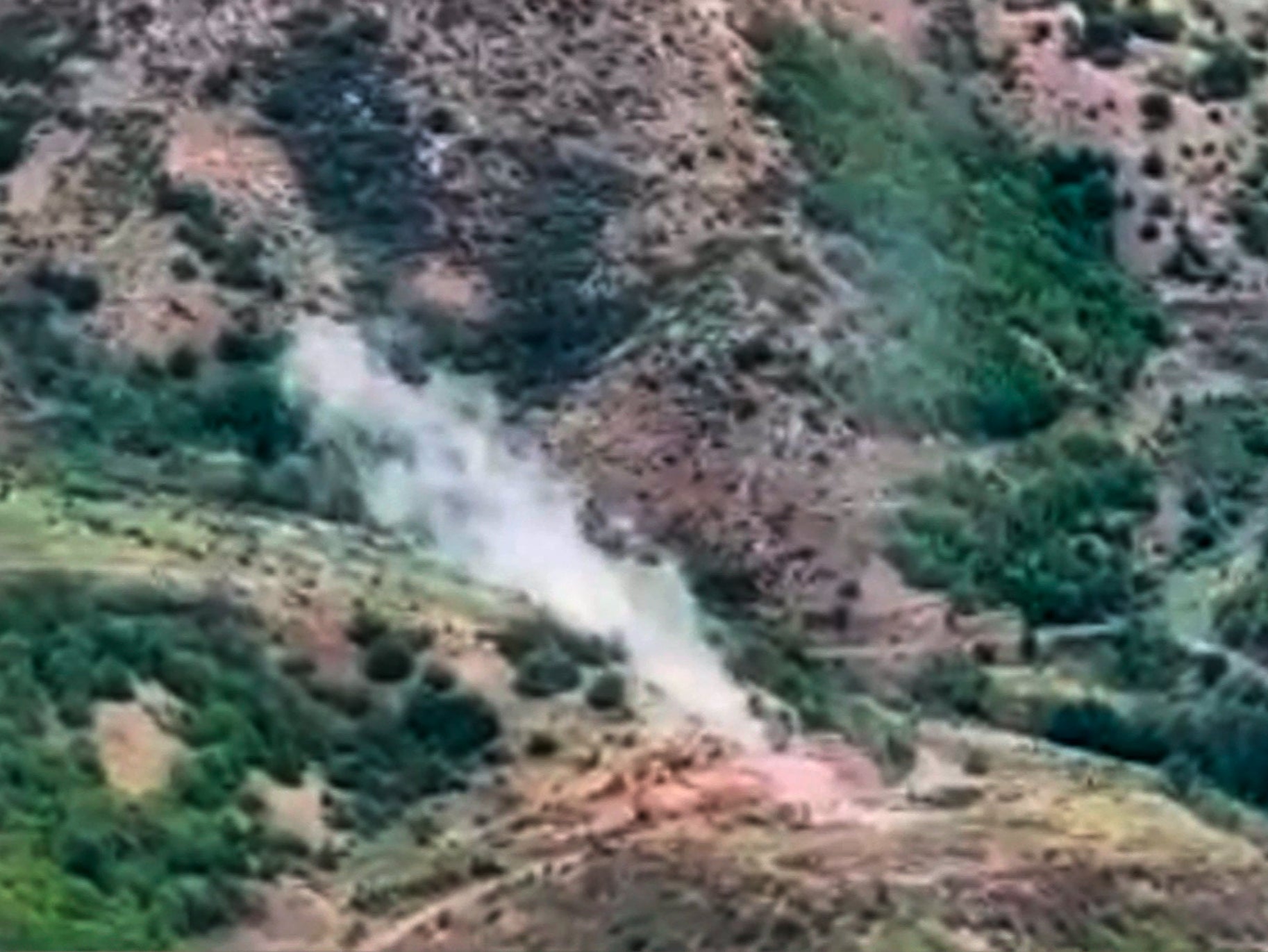 Smoke rises over an area which Azerbaijan says hosts Armenian forces’ position