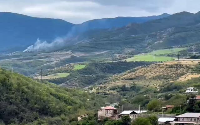 <p>Smoke from an explosion on a hilltop outside Stepanakert, Nagorno-Karabakh</p>