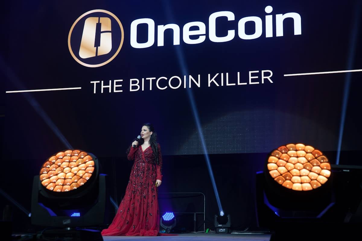 Ruja Ignatova onstage at a OneCoin conference