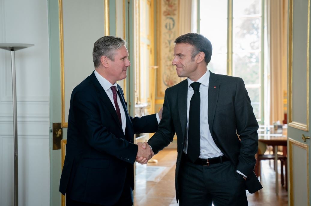 Sir Keir Starmer shakes hands with French president Emmanuel Macron at the Elysee Palace in Paris on Tuesday