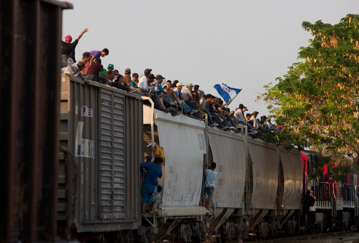 Mexican railway operator halts trains because so many migrants are climbing aboard and getting hurt