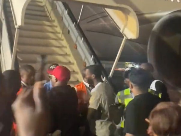Passengers tried to climb the steps onto the Brussels Airlines plane