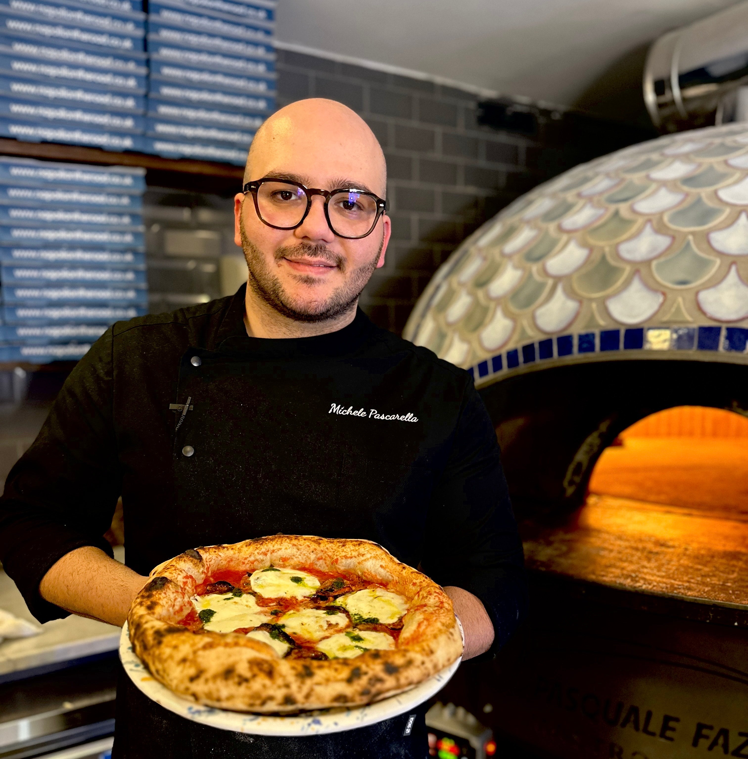 Michele Pascarella with one of his award-winning pizzas