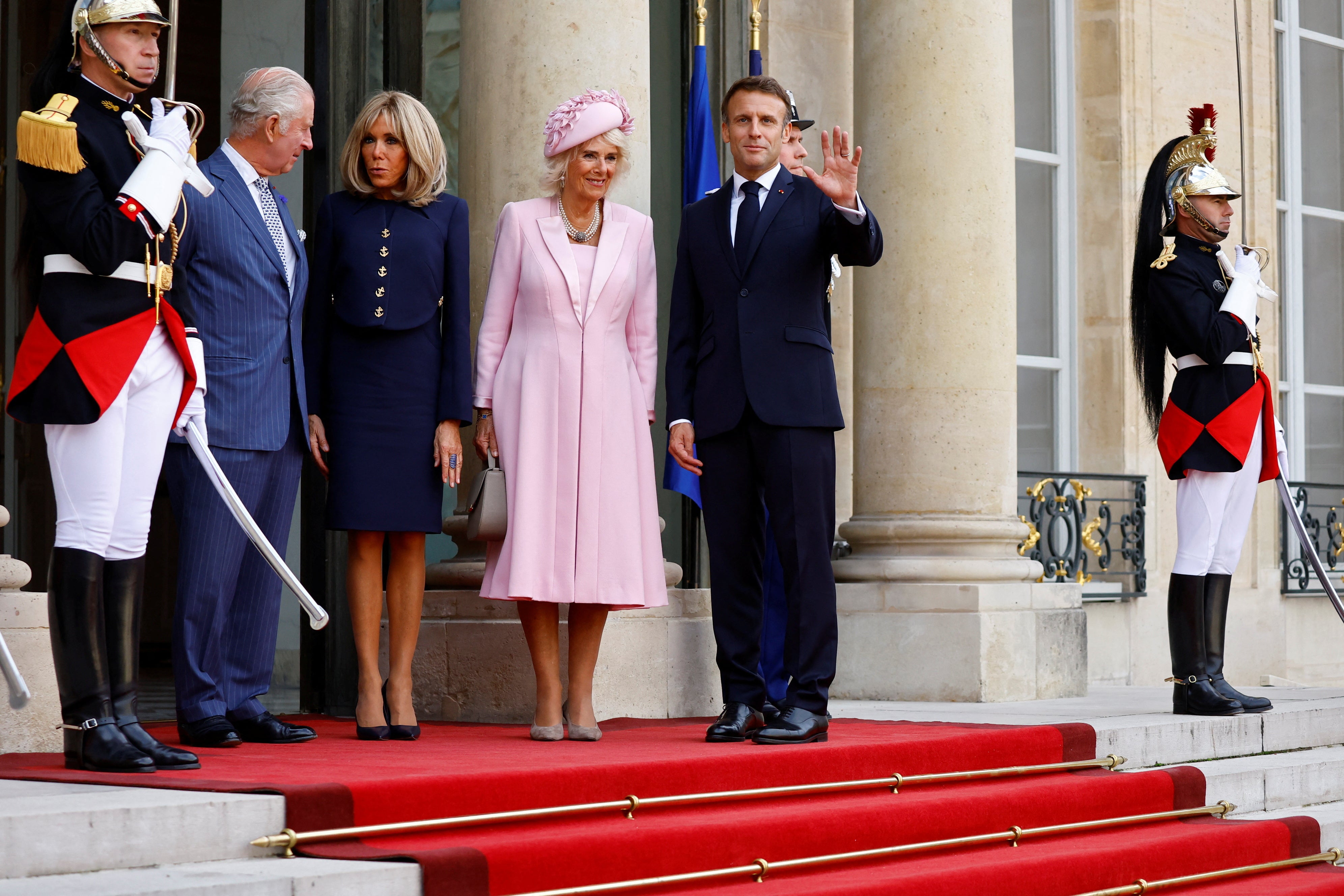 Emmanuel Macron, his wife Brigitte Macron, King Charles and Queen Camilla arrive for a meeting at the Elysee Palace in Paris