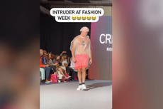 Intruder struts down New York Fashion Week catwalk in shower cap and bin bag