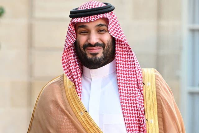 <p>Saudi Crown Prince Mohammed bin Salman smiles as he arrives at the Elysee Palace in Paris on July 28, 2022 for a meeting with the French President.</p>