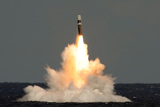 An unarmed Trident nuclear missile is fired from HMS Vigilant during a training exercise (Lockheed Martin/PA)