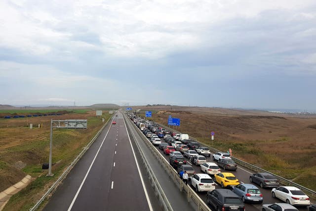 <p>File: Vehicle wait to cross the Crimean bridge near Kerch</p>
