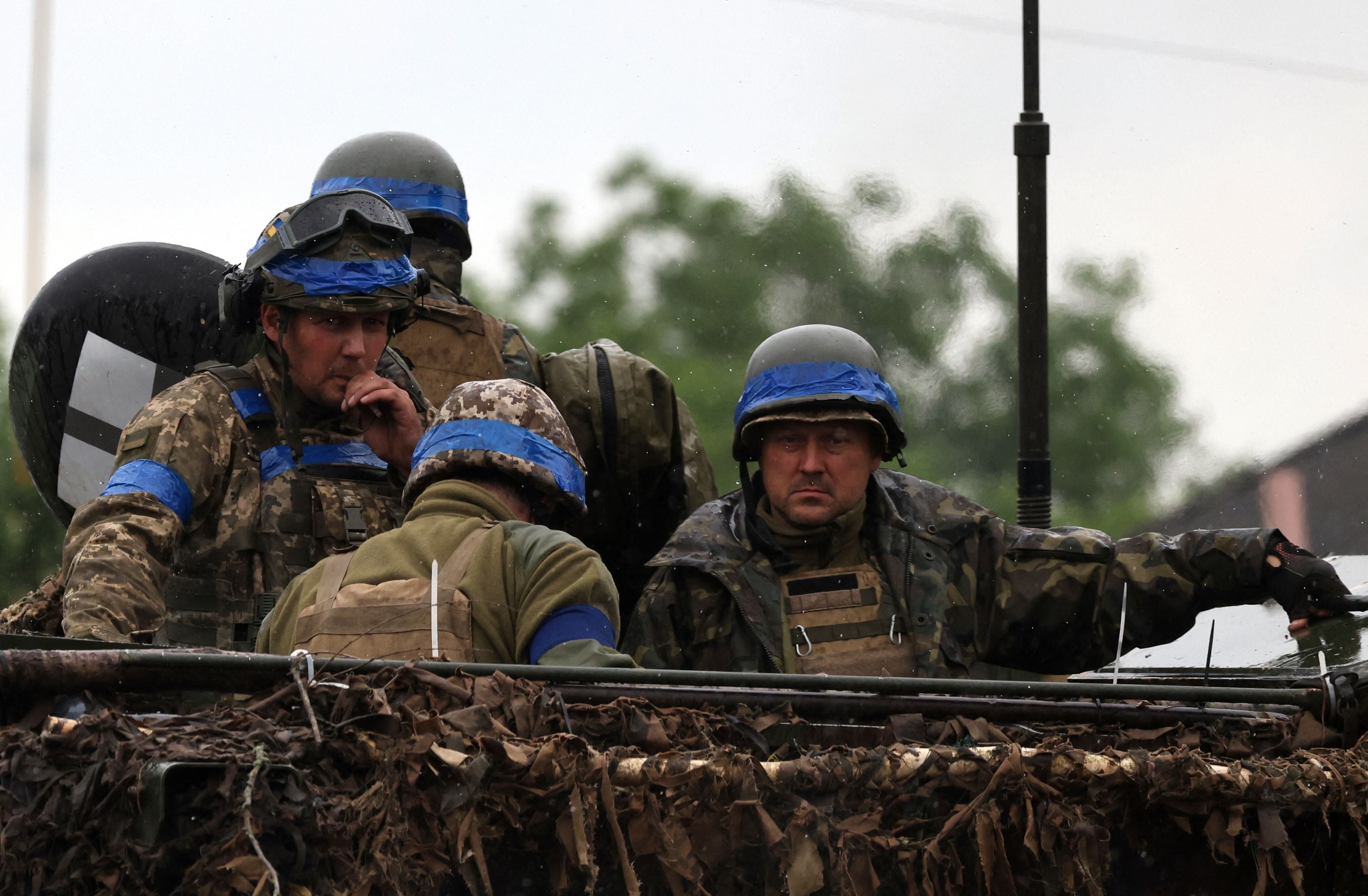 <p>File: Ukrainian servicemen ride atop an armoured personnel carrier vehicle (APC) in the Zaporizhzhia region</p>