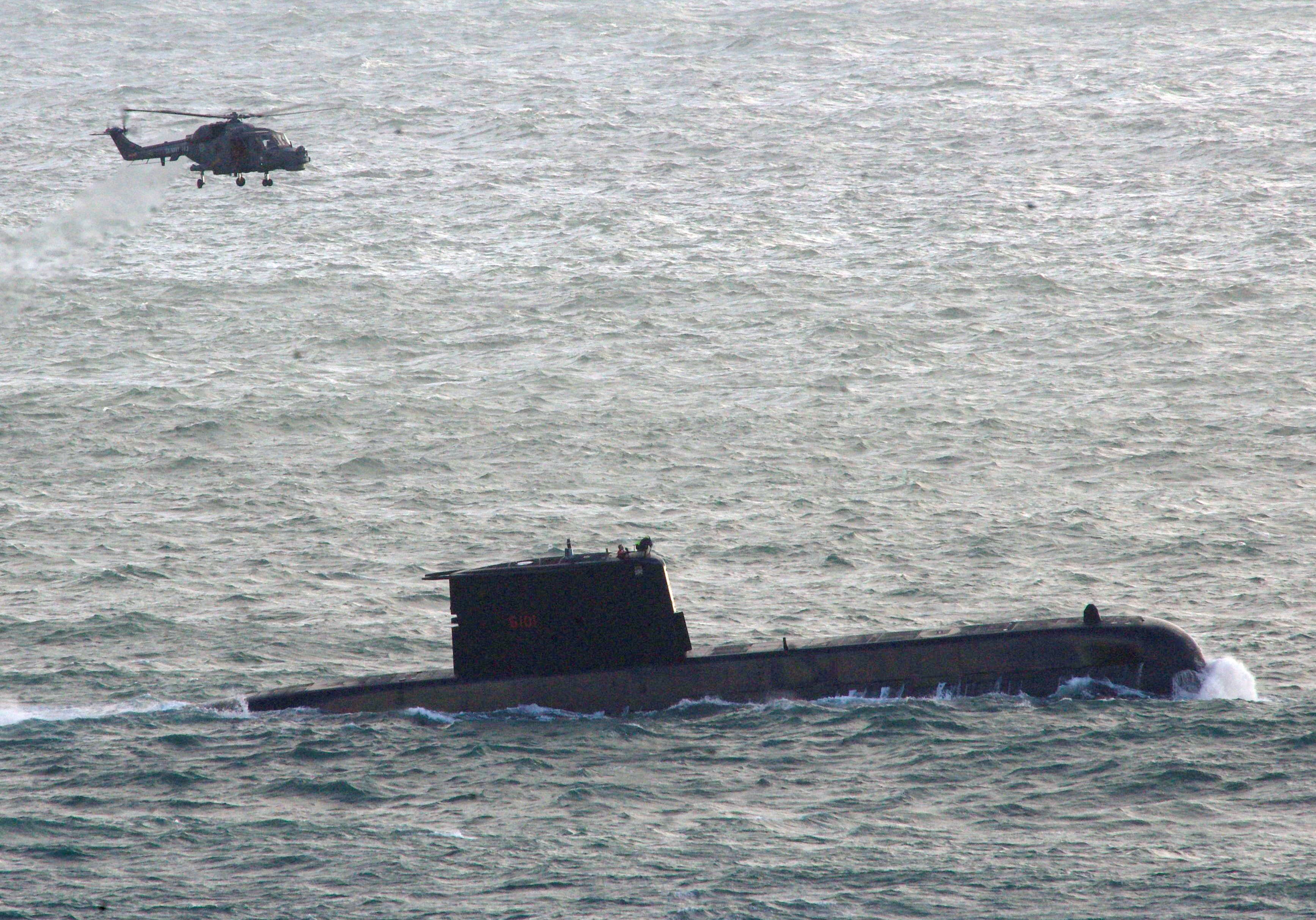 Seven submariners were swept off the vessel’s deck
