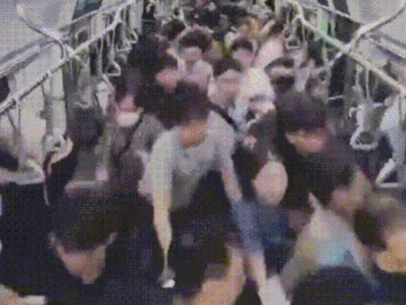 Security footage shows a stampede that occured after a man pushed his way through a subway train, sparking fears of a mass stabbing and injuring at least 21 people