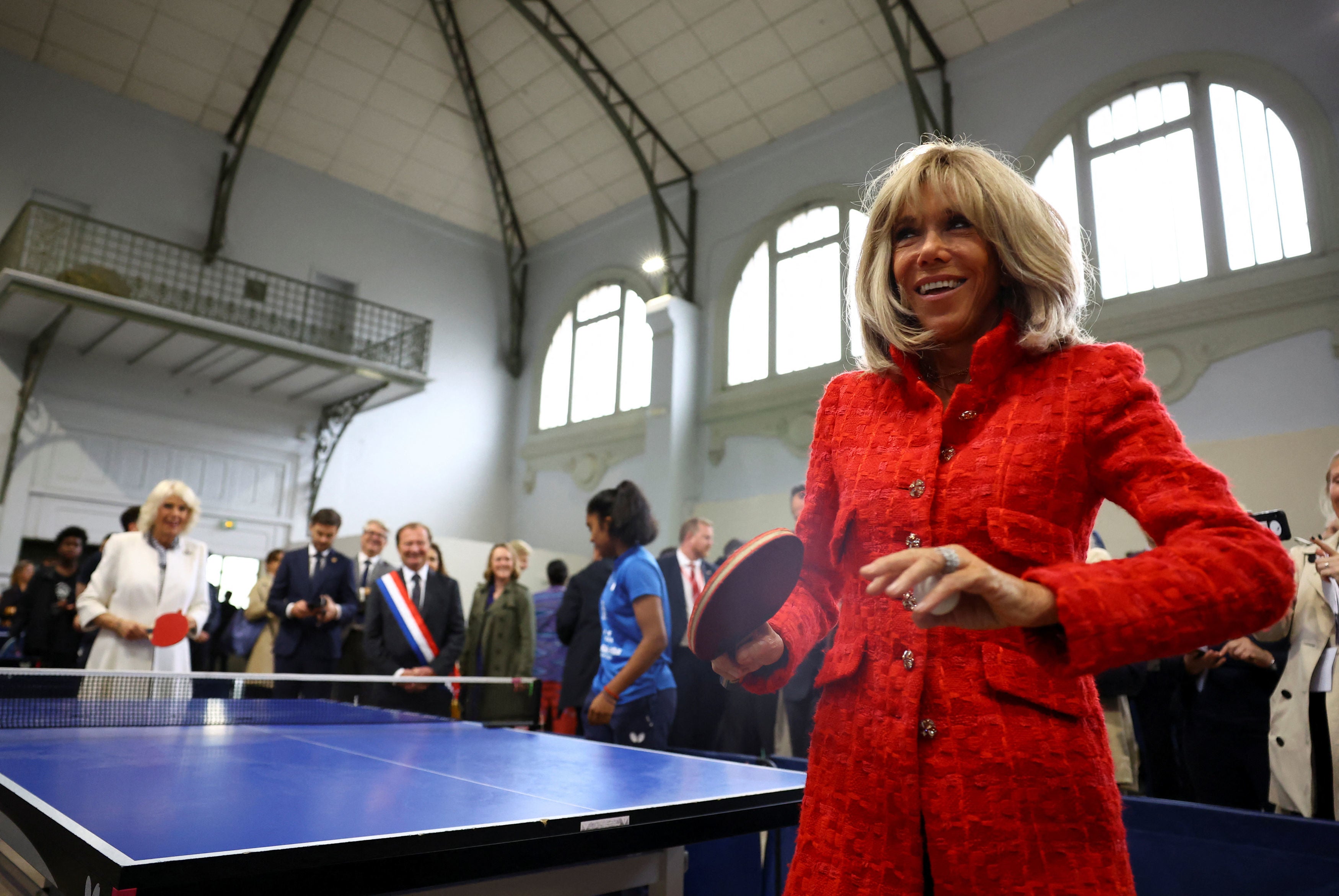 Camilla and the French first lady bonded over a game of table tennis at a community centre in Saint-Denis, northern Paris