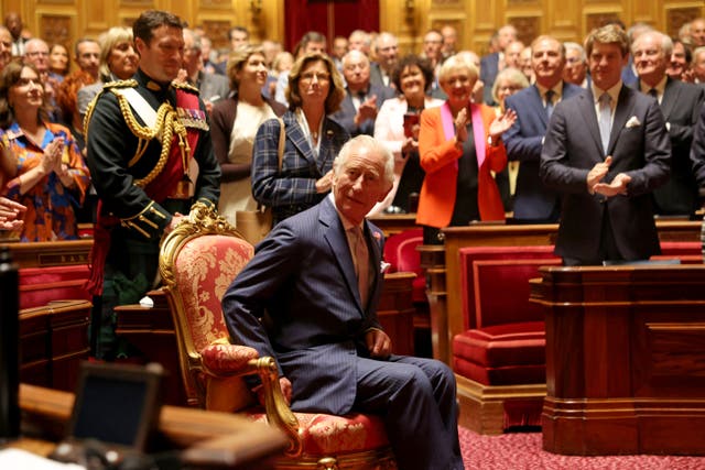 The King takes his seat during a visit to address parliamentarians in the Senate Chamber (Ian Vogler/Daily Mirror/PA)