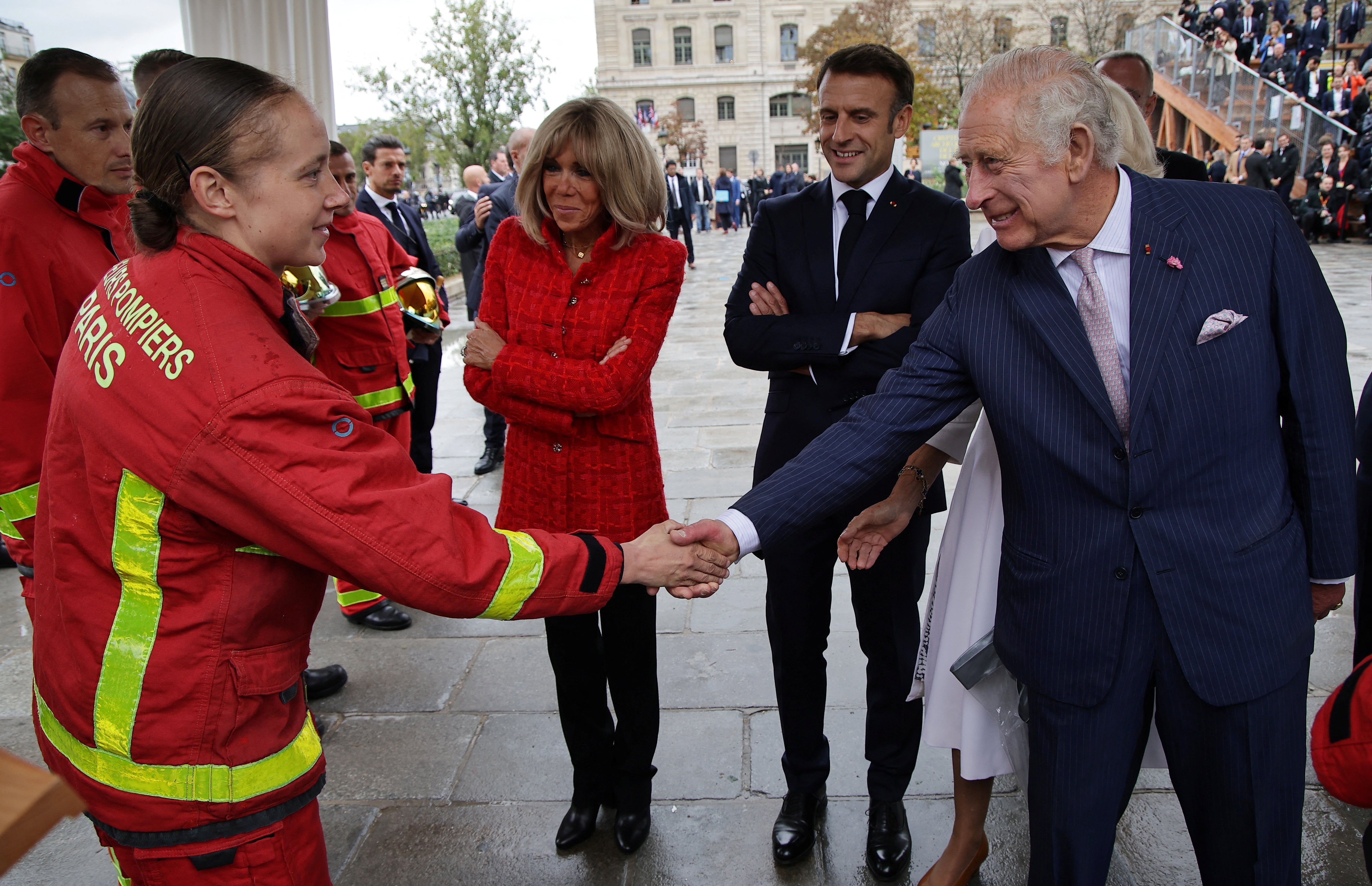 Charles, Camilla and the Macrons meet firefighters during a visit to the Notre-Dame Cathedral, which is undergoing a huge renovation after it was engulfed by a huge and devastating fire in 2019