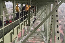 Teen, 19, gets stuck dangling from California’s highest bridge while filming stunt with friend