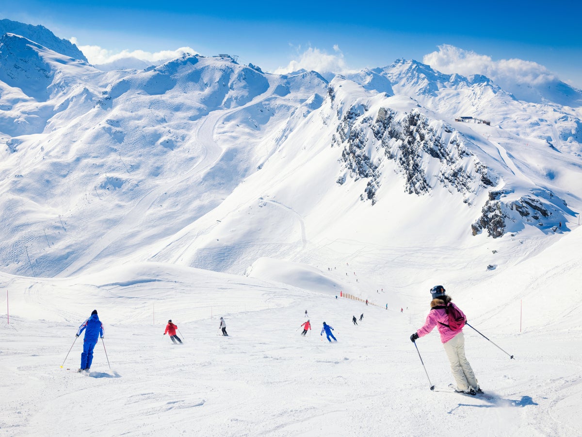 Premium Photo  Skier sliding down the mountain on the snow in the ski  resort