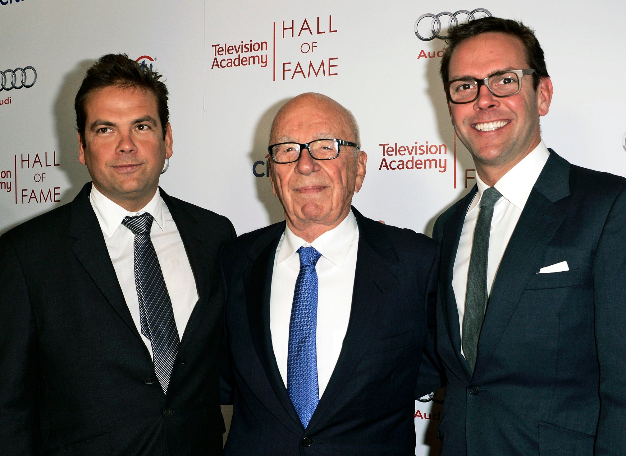 Rupert Murdoch, center, and his sons, Lachlan, left, and James Murdoch