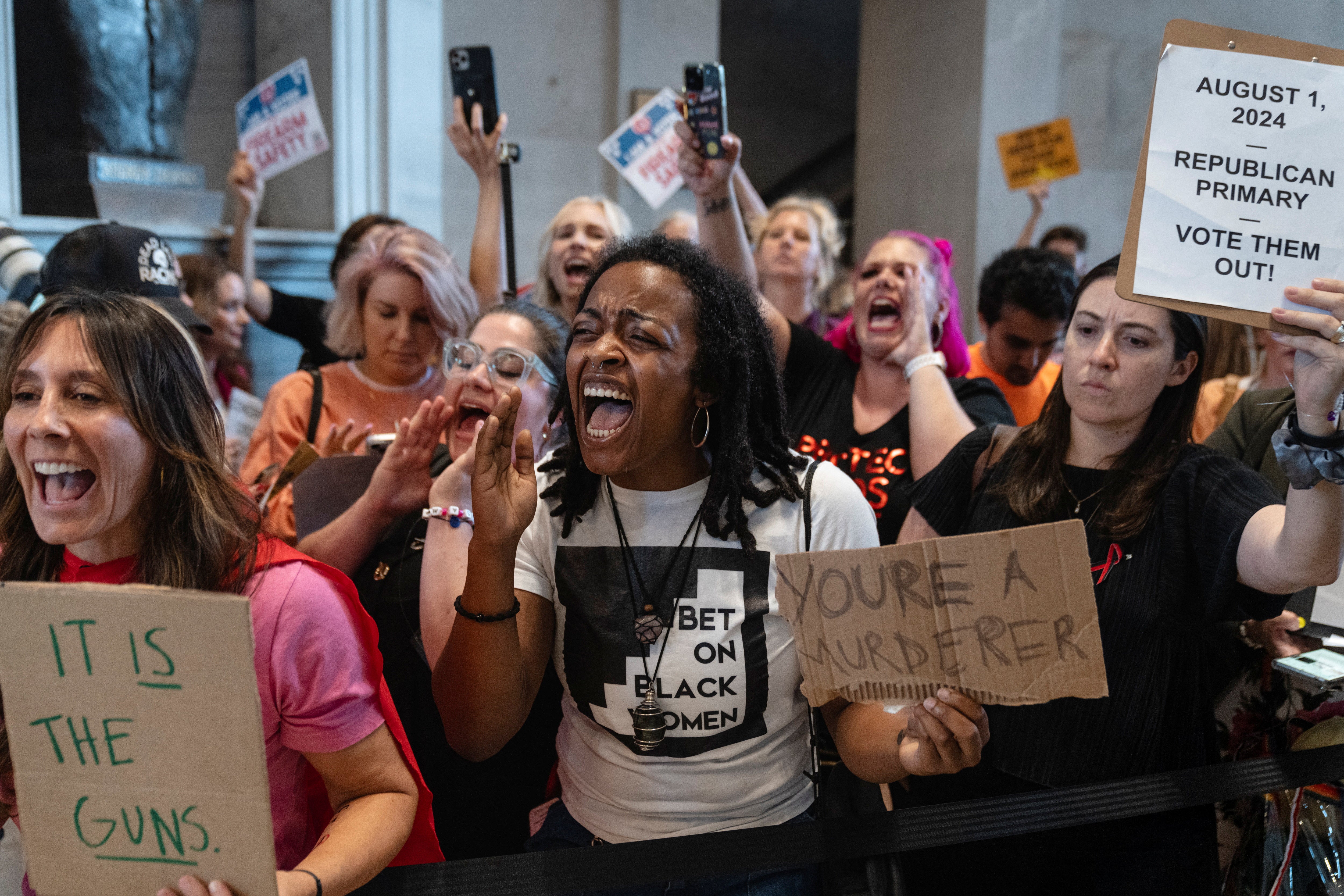 People protest outside the Tennessee House chamber after Democratic Tennessee state Rep Justin Jones was silenced by Republican lawmakers during a special session on gun violence on 28 August, 2023.