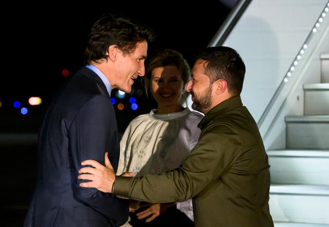 <p>Canadian prime minister Justin Trudeau, left, greets Ukrainian president Volodymyr Zelenskyy, right, as his wife Olena Zelenska looks on as they arrive at Ottawa Macdonald-Cartier International Airport in Ottawa, Ontario, on Thursday</p>