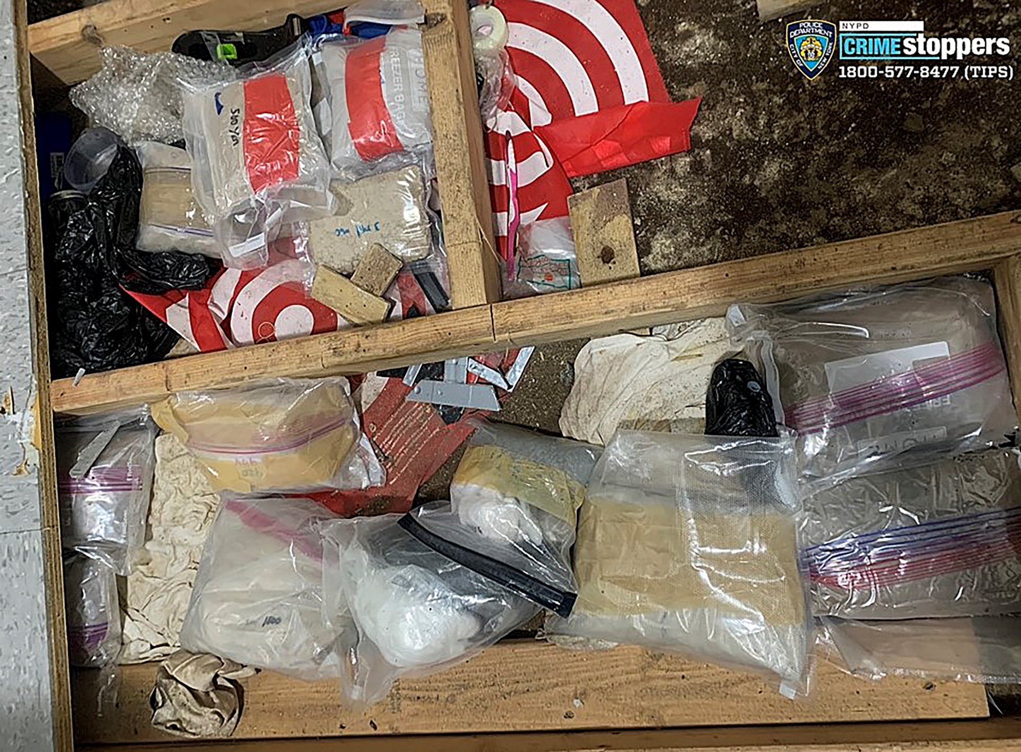 Narcotics, including fentanyl, and drug paraphernalia lie stored in the floor of a daycare centre