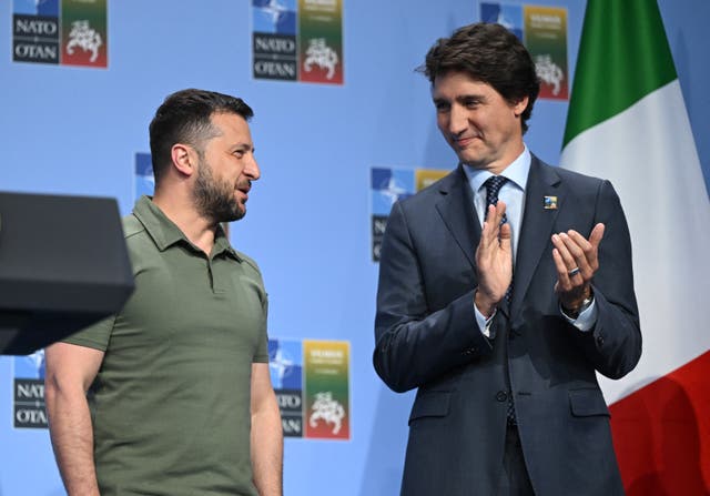 <p>Volodymyr Zelensky (left) talks to Canada’s prime minister Justin Trudeau during an event with G7 leaders during the Nato Summit in Vilnius</p>
