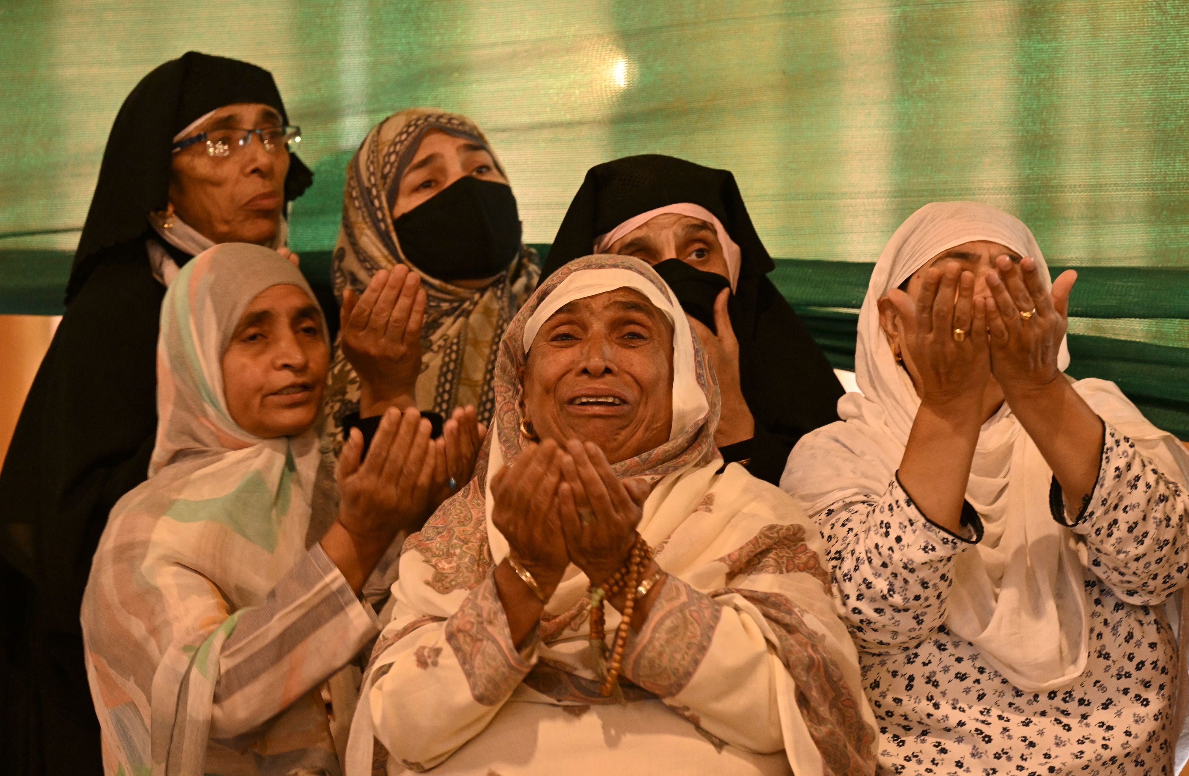 Kashmiri Muslim devotees pray after separatist leader Mirwaiz Umar Farooq released after four years