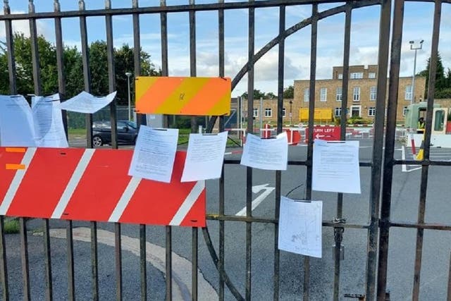The notices on the gates of RAF Scampton in Lincolnshire (West Lindsey District Council/PA)