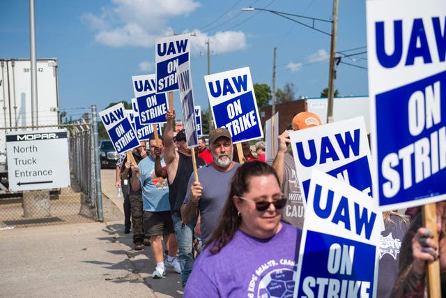 UAW members and workers at the Mopar Parts Center Line, a Stellantis Parts Distribution Center in Center Line, Michigan, picket outside the facility after walking off their jobs at noon on September 22, 2023