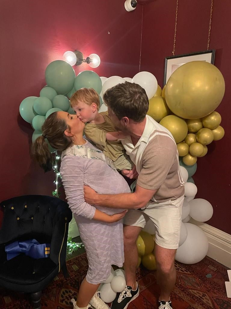Sarah, her partner Harry, and their son Oscar at the surprise baby shower
