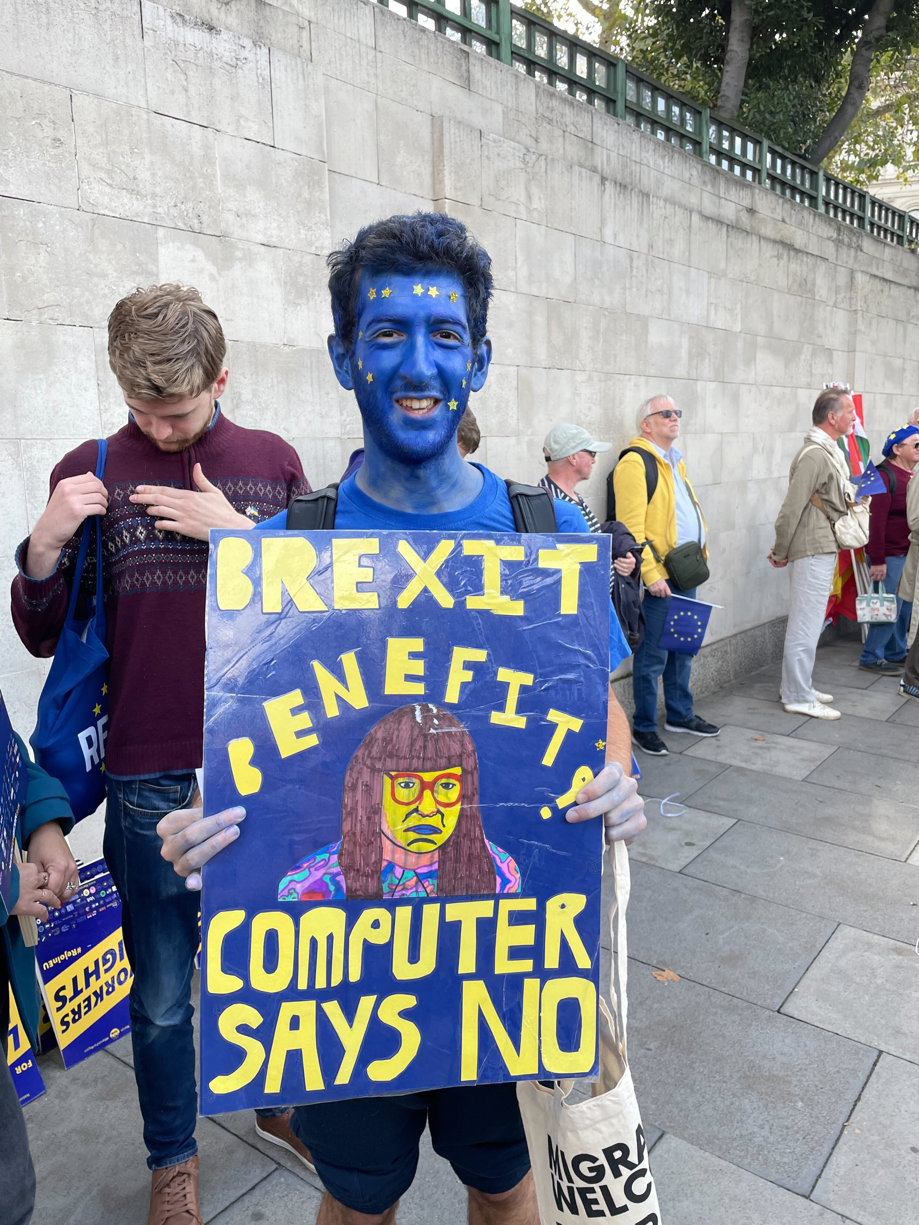 Eric Stoch was painted head to toe in blue body paint for the march